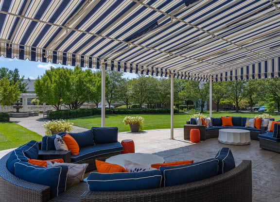a patio with couches and tables under a canopy at Bishops Gate, Cincinnati