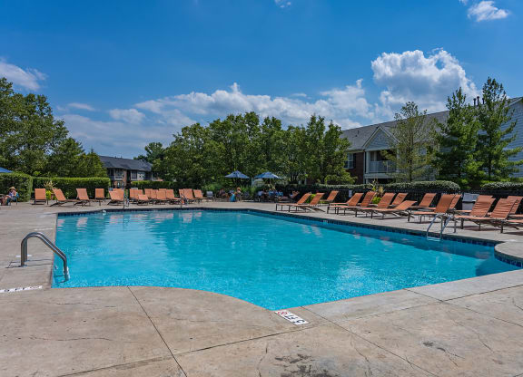 our resort style pool is filled with lounge chairs and a blue sky at Bishops Gate, Ohio, 45249
