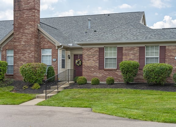 a brick house with a front yard and a stairway at Bishops Gate, Ohio, 45249