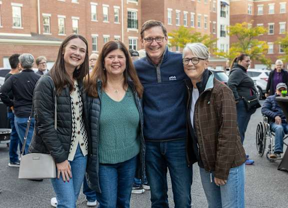 a group of people pose for a picture at Roebling Row, Kentucky