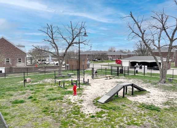 Playground with slide, swings, and a red fire hydrant at Meridian Court South, Indianapolis, Indiana