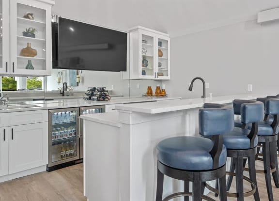 Kitchen with a breakfast bar and a flat screen tv at Normandy Club, Centerville, Ohio