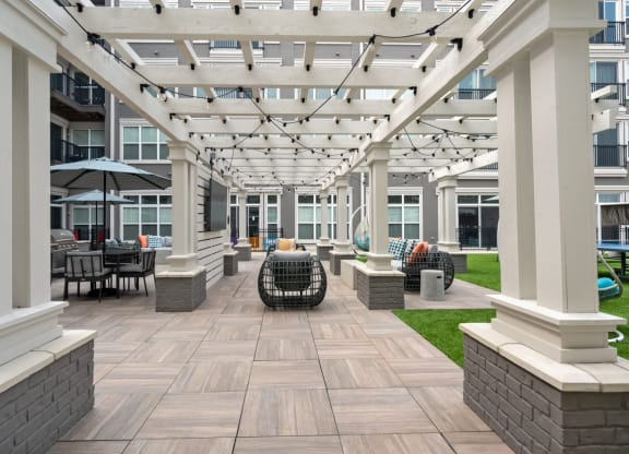 West Chester, OH Pet-Friendly Apartments - Liberty Center - Courtyard with Outdoor Furniture, Grilling Station, and Umbrella Tables
