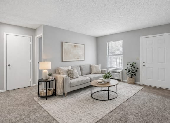 living room with painting on the wall at Timbercreek Apts, Columbus