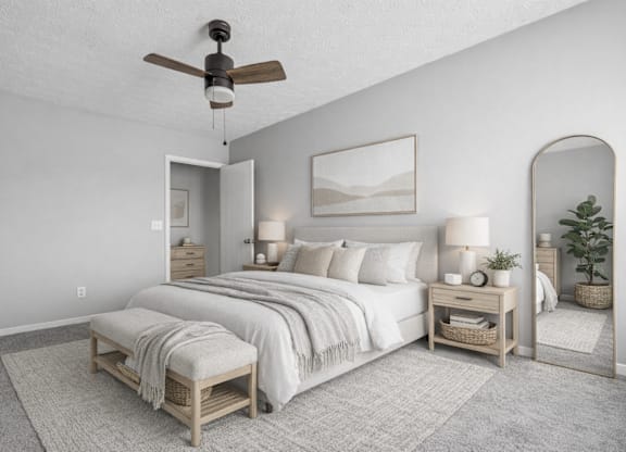 bedroom with a bed and large mirror at Timbercreek Apts, Columbus