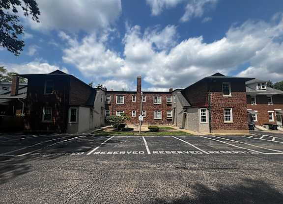 an empty parking lot in front of a brick building  at Cincinnati Premier Living*, Cincinnati, Ohio
