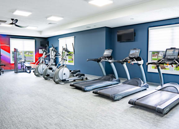 Gym with cardio machines and a television at Waterstone Landing, Ohio, 43551