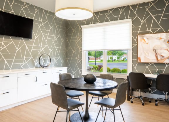 Dining room with a table and chairs and a window at Waterstone Landing, Perrysburg