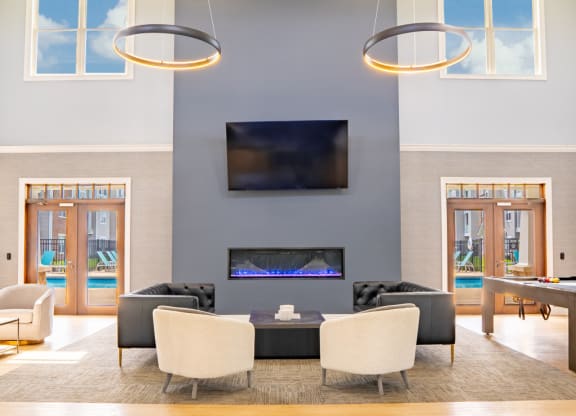 Living room with a television and a table and chairs  at Waterstone Landing, Ohio, 43551