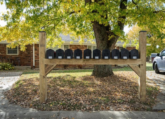 a mailbox post in front of a tree at Stonebrook of Franklin, Franklin, 46131