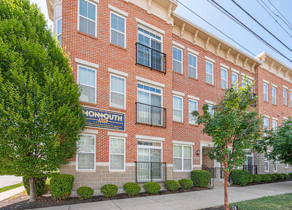 A red brick building with the word Monmouth on it.
