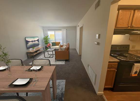 A modern kitchen with a dining table set for two.