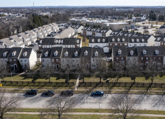 an aerial view of a neighborhood of houses with cars parked at Traditions at Slate Ridge, Reynoldsburg, 43068