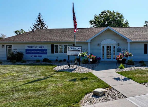 A building with a sign that says Willow Lake in front of it.