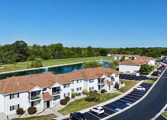 A residential area with houses and a parking lot.