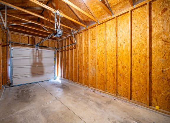 a garage with wooden walls and a garage door at Traditions at Slate Ridge, Reynoldsburg Ohio