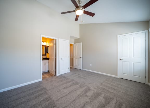 a living room with carpet and a ceiling fan at Traditions at Slate Ridge, Reynoldsburg, 43068