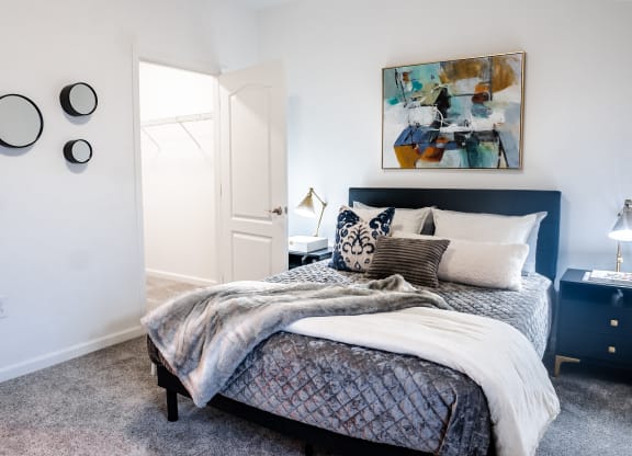 a bedroom with a bed and two nightstands  at Waterstone Landing, Perrysburg