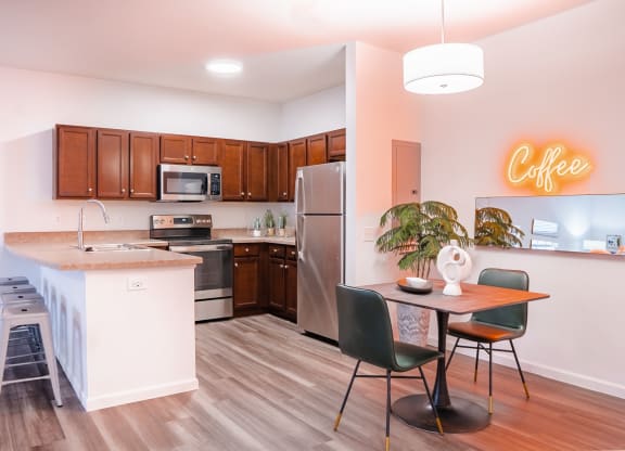 a kitchen and dining area in a 555 waverly unit  at Waterstone Landing, Perrysburg, Ohio