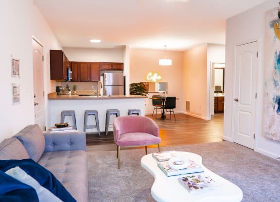 a living area with a couch coffee table and a kitchen in the background  at Waterstone Landing, Perrysburg, Ohio