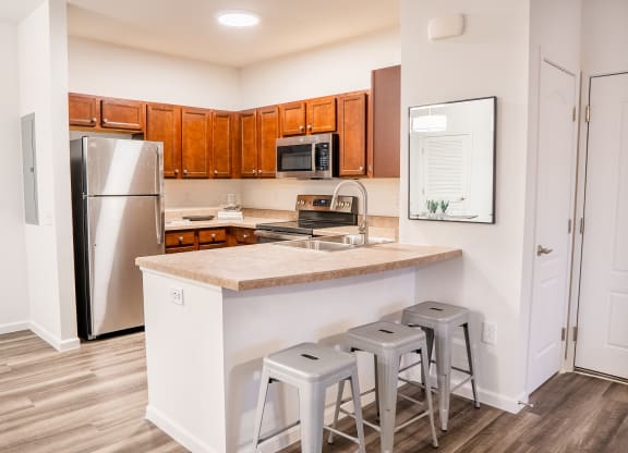 a kitchen with a large island and stainless steel appliances at Waterstone Landing, Ohio, 43551