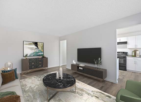 A modern living room with a black coffee table and a flat screen TV.