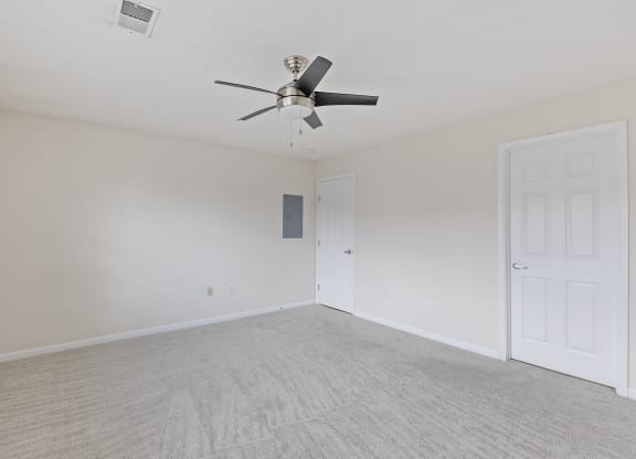 an empty living room with a ceiling fan at Four Bridges, Liberty Township, 45044-8380