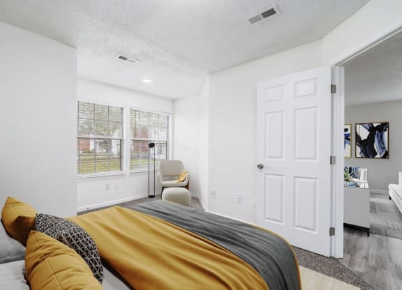 a bedroom with a bed and a window at The Berryessa Apartments, Columbus, OH