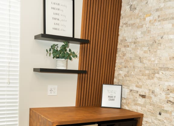 Room with a fireplace and a wooden cabinet with rocks in it at Honey Creek, 46143