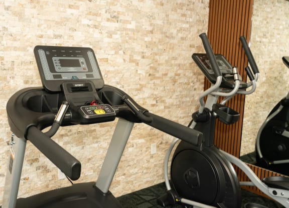 Treadmill with a monitor on the top of it at Honey Creek, Greenwood, IN