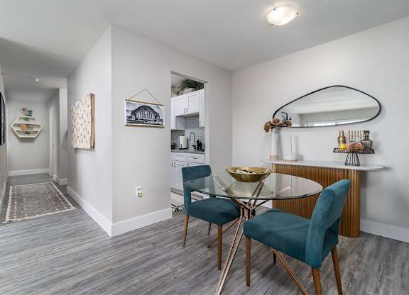 a dining room with a glass table and chairs at The Heights Apartments, Ohio, 45220