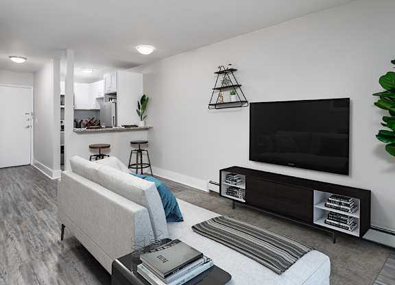 a living room with a couch and a television at The Heights Apartments, Cincinnati, 45220