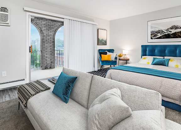 a living room with a couch and a bed at The Heights Apartments, Cincinnati, OH, 45220