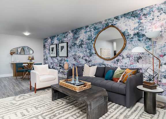 a living room with a couch and a coffee table at The Heights Apartments, Cincinnati