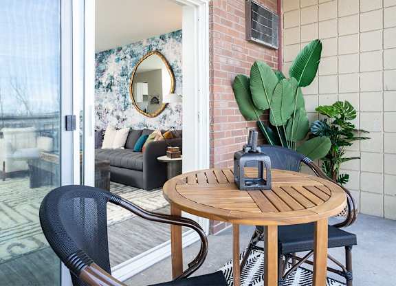 a small patio with a table and chairs at The Heights Apartments, Cincinnati, OH