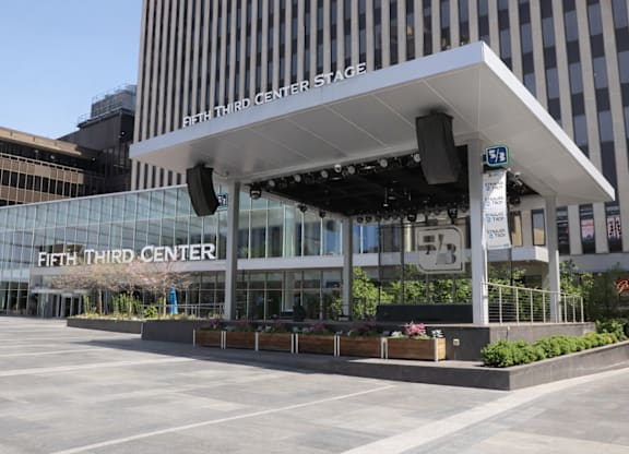 The Fifth Third Center Stage is a large building with a glass facade.
