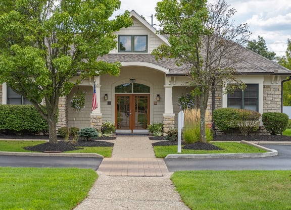 a house with a walkway leading to the front door at Four Bridges, Liberty Township, OH