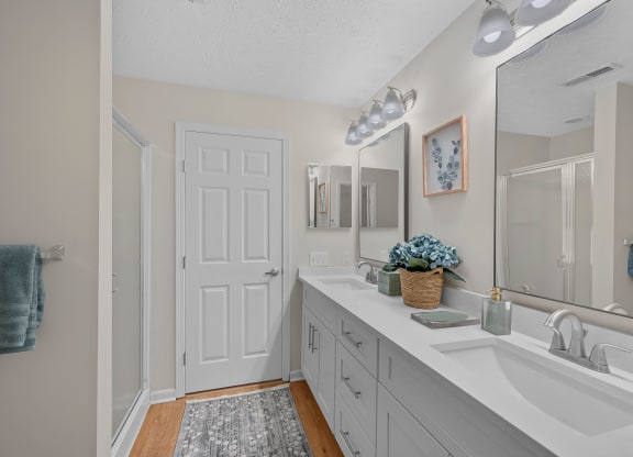 White bathroom with a sink and a mirror at Four Bridges, Liberty Township, Ohio