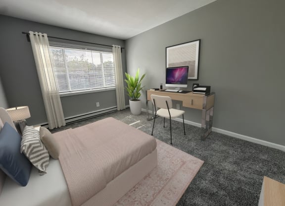 a bedroom with a bed and a desk with a computer