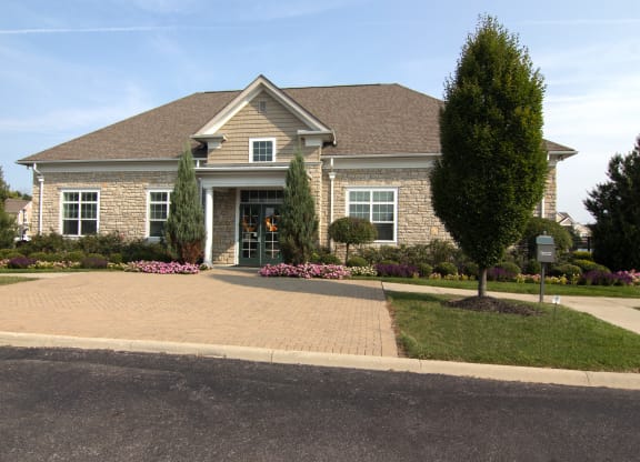 a house with a driveway and trees in front of it  at Grove City Summit, Ohio, 43123