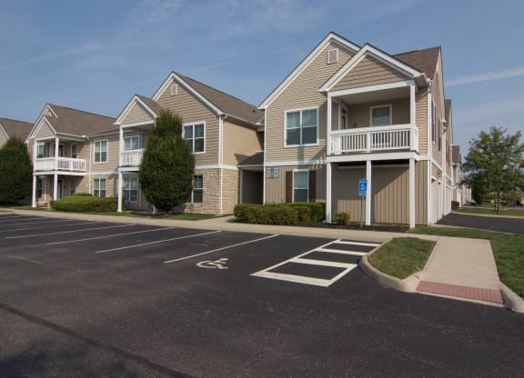 an empty parking lot in front of a row of houses  at Grove City Summit, Ohio