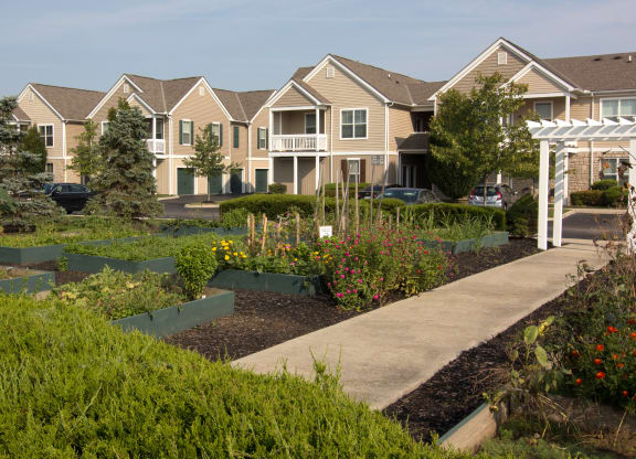 a community garden in front of a row of houses  at Grove City Summit, Grove City, OH, 43123