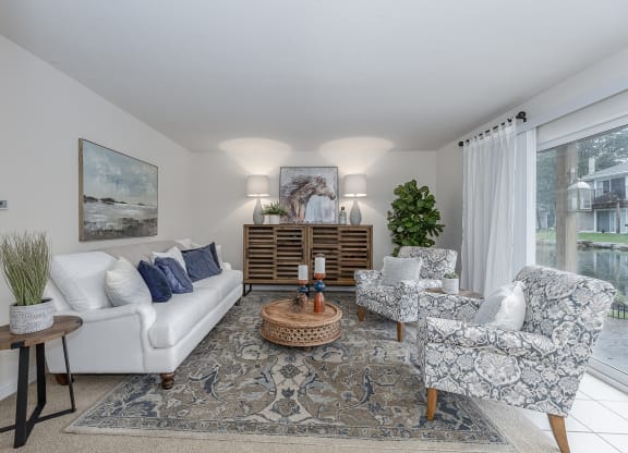 Living room with open kitchen at Harpers Point Apartments, Ohio