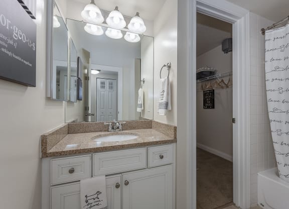 Bathroom and closet at Harpers Point Apartments, Cincinnati, OH