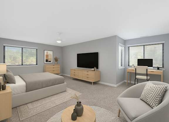 A modern living room with a grey sofa, a wooden coffee table, and a television.