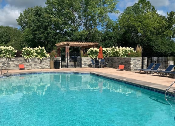 a large swimming pool with chairs around it at Ivy Hills Living Spaces, Cincinnati