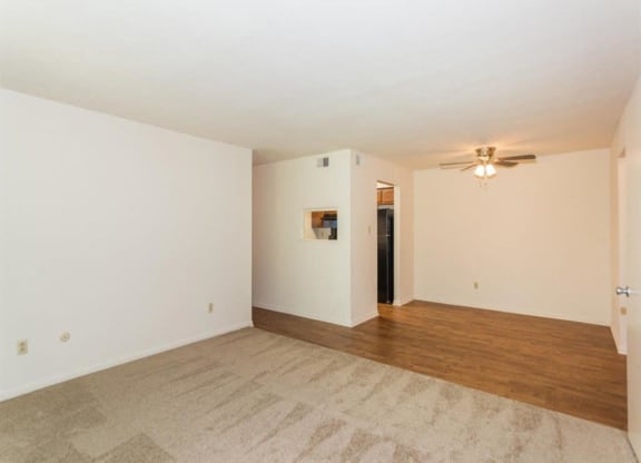 Living room with ceiling fan and light at Quail Run, Indiana