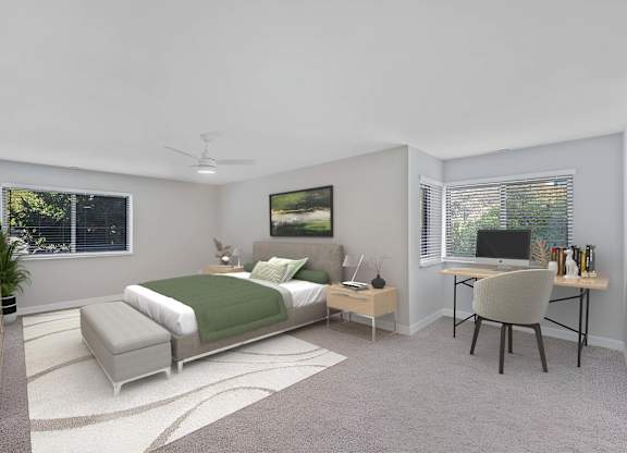 A bedroom with a bed, desk, and chair. at Indian Creek Apartments*, Cincinnati, Ohio