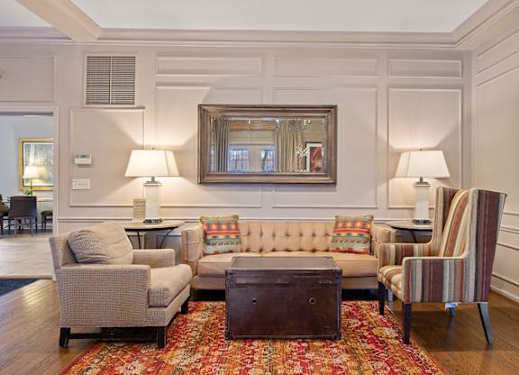 a living room with couches chairs and a table at Indian Creek Apartments*, Ohio