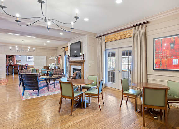 a living room with tables and chairs and a fireplace at Indian Creek Apartments*, Ohio, 45236